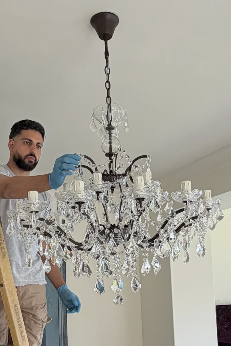 Chandelier-installed-dining-room Chandelier installed in dining room